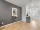 Entryway with grey accent wall, light hardwood floors, and decorative elements at 2918 Rodrick Cir, Orlando, FL 32824