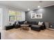 Bright living room featuring a large sectional sofa, hardwood floors, recessed lighting, and neutral color palette at 2918 Rodrick Cir, Orlando, FL 32824