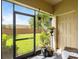 Screened patio featuring hanging plants, a door to the backyard, and outdoor seating at 2918 Rodrick Cir, Orlando, FL 32824
