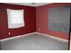 A room with red walls and tiled flooring at 305 E Orange St, Altamonte Springs, FL 32701