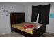 Bedroom featuring a bed, curtains, and grey walls at 305 E Orange St, Altamonte Springs, FL 32701