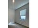 Carpeted room with window providing natural light and neutral paint at 3213 Energy Dr, Kissimmee, FL 34747