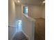 Upstairs hallway provides access to the bedrooms via a short flight of carpeted stairs at 3213 Energy Dr, Kissimmee, FL 34747