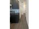 Hallway with luxury vinyl plank flooring leading into the kitchen at 3213 Energy Dr, Kissimmee, FL 34747