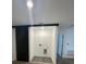 Well lit laundry room featuring sliding door, wire shelving, and connections for a washer and dryer at 3213 Energy Dr, Kissimmee, FL 34747