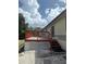 Close up of a charming back deck with stairs leading to the yard at 34008 S Haines Creek Rd, Leesburg, FL 34788