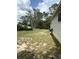 Expansive backyard featuring mature trees and space for outdoor activities at 34008 S Haines Creek Rd, Leesburg, FL 34788