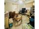 Bedroom with tile flooring, a ceiling fan, and a computer desk at 34008 S Haines Creek Rd, Leesburg, FL 34788