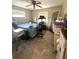 Bedroom with natural light, tile floors, and a shoe rack at 34008 S Haines Creek Rd, Leesburg, FL 34788
