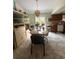 Bright dining area with a large glass doors to the back and tile flooring at 34008 S Haines Creek Rd, Leesburg, FL 34788