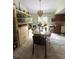 Bright dining area with a large glass doors to the back and tile flooring at 34008 S Haines Creek Rd, Leesburg, FL 34788