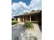 Close up of the front porch and stone garden of this well-maintained home at 34008 S Haines Creek Rd, Leesburg, FL 34788