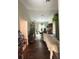 Hallway leading to the dining room with hardwood floors and a view of the backyard at 34008 S Haines Creek Rd, Leesburg, FL 34788