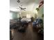 Spacious living room with hardwood floors and a vaulted ceiling, offering plenty of natural light at 34008 S Haines Creek Rd, Leesburg, FL 34788