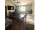 Cozy living room featuring a flatscreen TV, hardwood floors, and ample seating for entertaining at 34008 S Haines Creek Rd, Leesburg, FL 34788