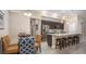 Cozy dining area adjacent to a modern kitchen, featuring stylish chairs and a view of the kitchen at 345 S Sunset Ave, Mascotte, FL 34753