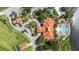 Aerial view of the community clubhouse, pool, and surrounding lush landscaping, showcasing the prime location at 363 Miro Dr, Davenport, FL 33837