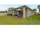 Relaxing backyard featuring patio seating and an open grassy area perfect for outdoor enjoyment at 363 Miro Dr, Davenport, FL 33837