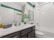 Well-appointed bathroom boasts a sleek vanity, subway tile shower, and modern fixtures at 363 Miro Dr, Davenport, FL 33837