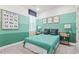 Charming bedroom features a custom paint scheme, playful dinosaur art, and cozy accents for a retreat at 363 Miro Dr, Davenport, FL 33837