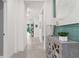 Bright hallway featuring neutral walls, and an elegant console table with stylish decor for a welcoming ambiance at 363 Miro Dr, Davenport, FL 33837