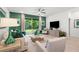 Cozy living room featuring stylish decor, a comfortable sofa, and sliding glass doors to the outdoor space at 363 Miro Dr, Davenport, FL 33837