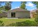 Well-maintained backyard with a patio, lawn and secure sliding glass door at 369 Placid Lake Dr, Sanford, FL 32773