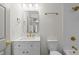 Elegant bathroom featuring gold fixtures, sleek white vanity and ample lighting at 369 Placid Lake Dr, Sanford, FL 32773