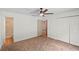 Spacious bedroom with neutral carpet, ceiling fan, access to bathroom and closet at 369 Placid Lake Dr, Sanford, FL 32773