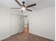 Carpeted bedroom with a ceiling fan and a double door closet at 369 Placid Lake Dr, Sanford, FL 32773