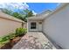 Inviting walkway leading to the home's entrance, complemented by manicured landscaping and a cozy porch at 369 Placid Lake Dr, Sanford, FL 32773