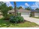 Charming single-story home featuring a well-manicured lawn and beautiful landscaping at 369 Placid Lake Dr, Sanford, FL 32773