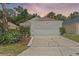 Charming single-story home featuring a two-car garage and lovely landscaping at 369 Placid Lake Dr, Sanford, FL 32773