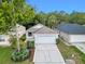 Beautiful home with a well-maintained lawn, mature trees, and convenient two-car garage at 369 Placid Lake Dr, Sanford, FL 32773