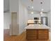 Modern kitchen featuring white cabinets, stainless steel appliances, and a large island with pendant lighting at 369 Placid Lake Dr, Sanford, FL 32773