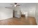 Spacious living room that flows seamlessly into a modern kitchen, enhanced with hardwood floors and natural light at 369 Placid Lake Dr, Sanford, FL 32773