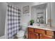 Well-lit bathroom offering a white vanity countertop, wood cabinets and shower/tub combination at 381 Cabello Dr, Davenport, FL 33837