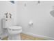 The bathroom features a modern toilet, tile floors, and a wall-mounted sink, maximizing space and functionality at 381 Cabello Dr, Davenport, FL 33837
