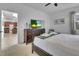 This bedroom features a TV, dresser, and access to the kitchen, creating a convenient and comfortable space at 381 Cabello Dr, Davenport, FL 33837