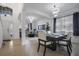 Bright dining area with tile floors and contemporary lighting next to living room at 381 Cabello Dr, Davenport, FL 33837