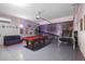 This game room is equipped with a pool table, a sofa, and fun décor at 381 Cabello Dr, Davenport, FL 33837