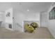 The landing features two unique green chairs and carpet flooring, creating a cozy and inviting space at 381 Cabello Dr, Davenport, FL 33837