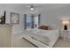 Bright main bedroom featuring a white bed, side tables and flat screen TV at 381 Cabello Dr, Davenport, FL 33837