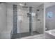 Spa-like bathroom featuring a glass-enclosed shower with bench and stylish tile accents at 40140 Swift Rd, Eustis, FL 32736