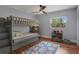 Cozy bedroom with bunk beds, a colorful rug, and ample storage space at 40140 Swift Rd, Eustis, FL 32736