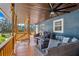 Covered patio with comfortable seating, perfect for outdoor enjoyment at 40140 Swift Rd, Eustis, FL 32736