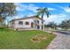Two-story home with manicured front yard, brick driveway and walkway leading to the front entrance at 40140 Swift Rd, Eustis, FL 32736