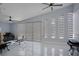Bright living room boasts high ceilings, modern window coverings and sleek tile flooring at 40140 Swift Rd, Eustis, FL 32736
