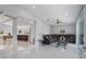 Bright living room with an open floor plan, recessed lighting, and tile flooring at 40140 Swift Rd, Eustis, FL 32736