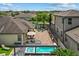 Aerial view of the home with a patio, hot tub, pergola, trampoline, and lush landscaping at 5182 Appenine E Loop, St Cloud, FL 34771